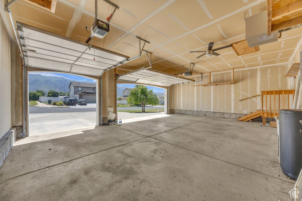 Garage with a garage door opener and a mountain view