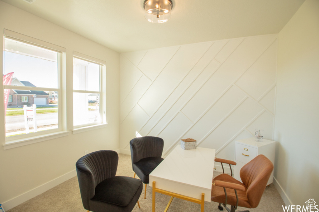 Home office featuring carpet floors and baseboards