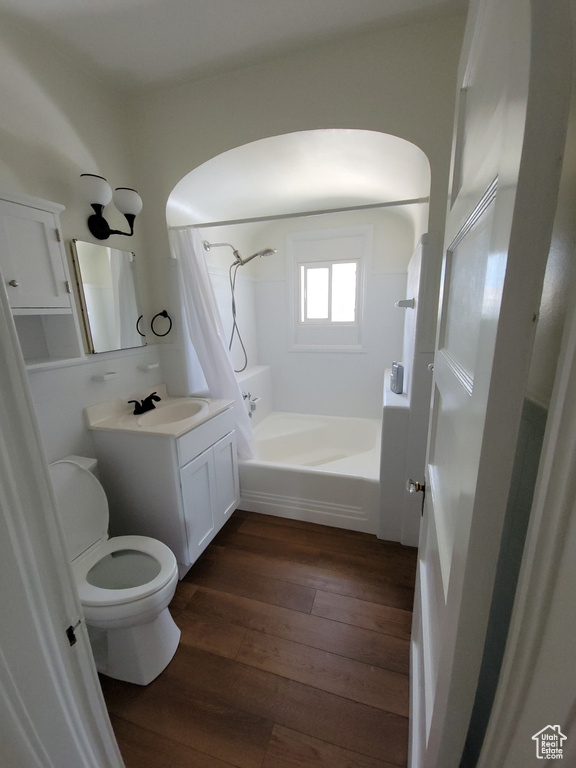 Full bathroom featuring vanity, wood-type flooring, and shower / bath combination