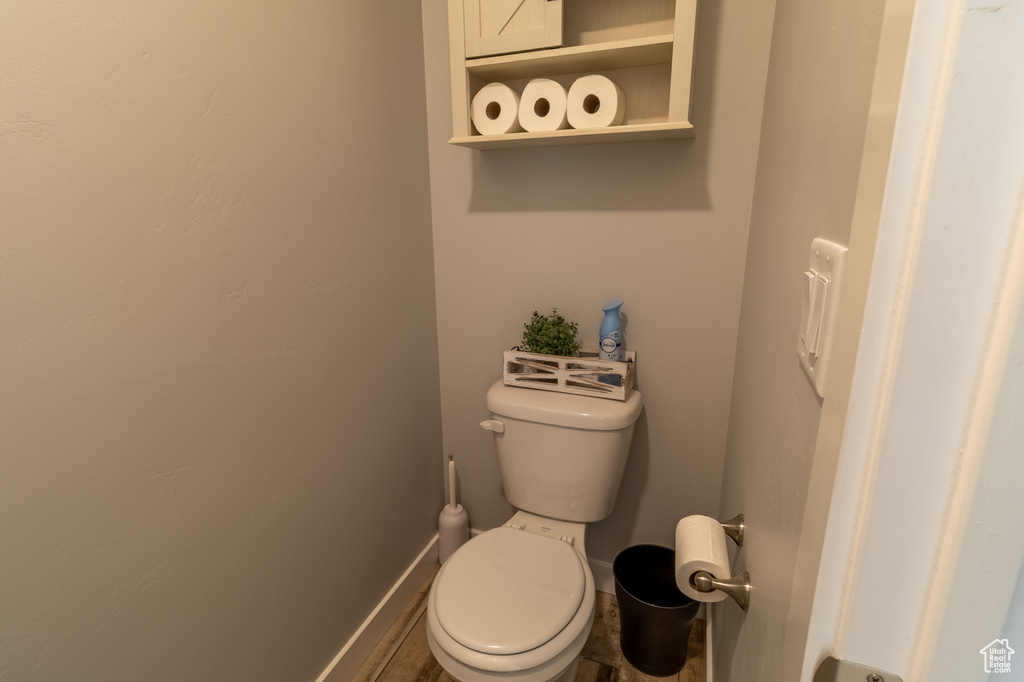 Bathroom featuring toilet and baseboards