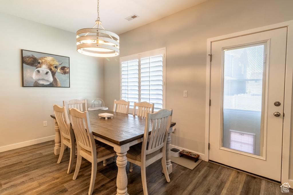 Dining room featuring a chandelier and wood finished floors