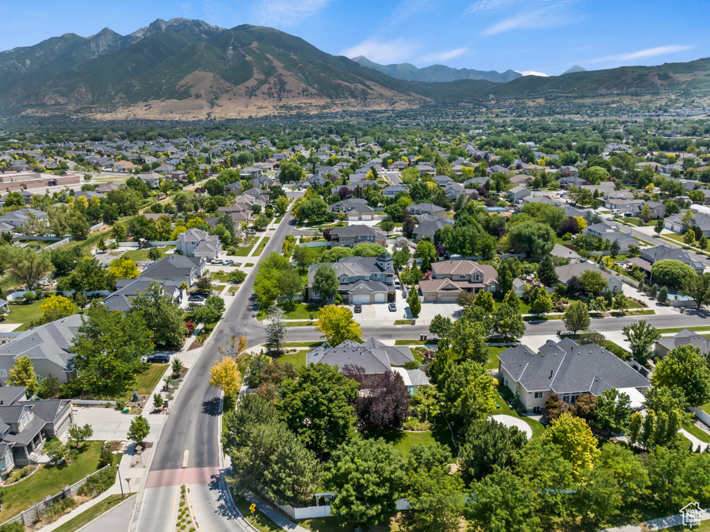 Aerial perspective of suburban area with a mountainous background