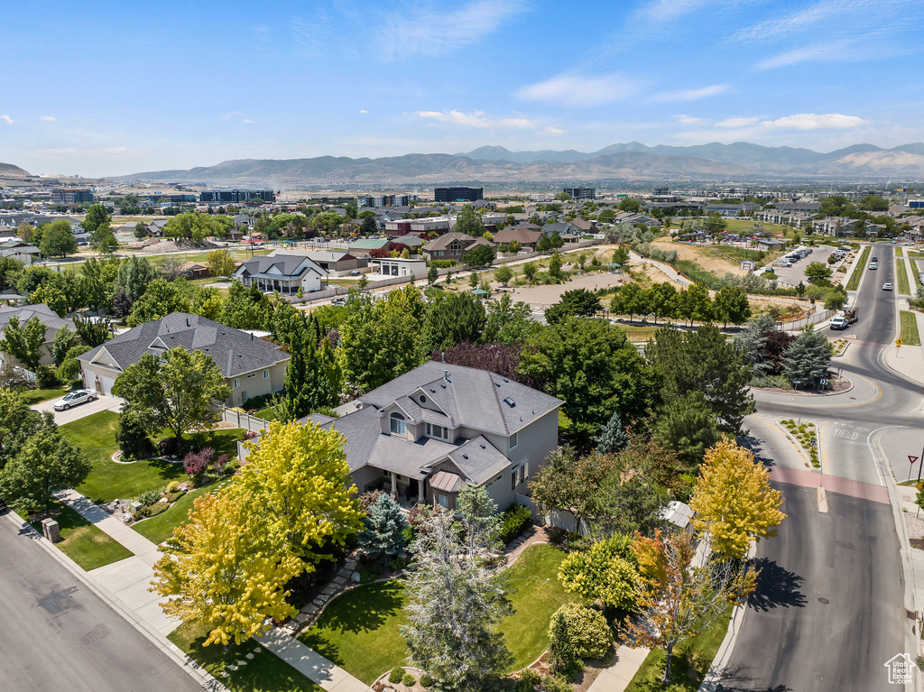 Aerial perspective of suburban area featuring a mountainous background