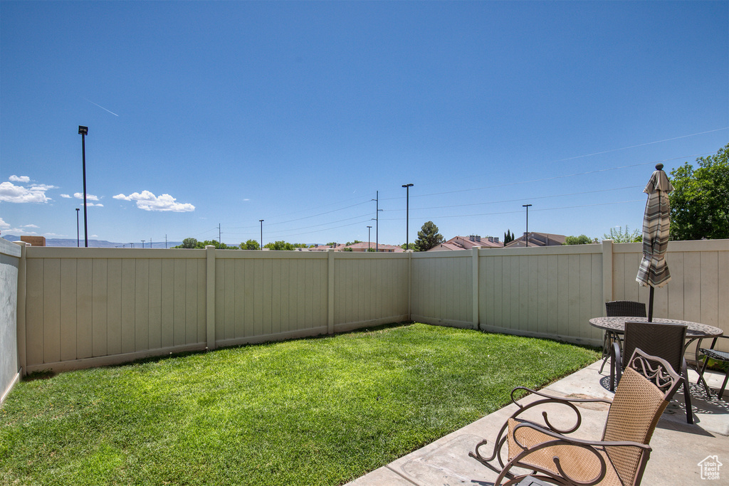 Fenced backyard with a patio area