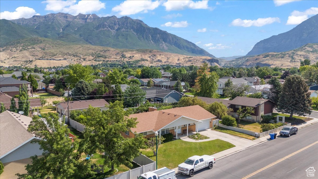 Aerial perspective of suburban area with a mountainous background