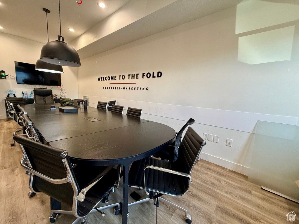 Office area featuring light wood finished floors and recessed lighting