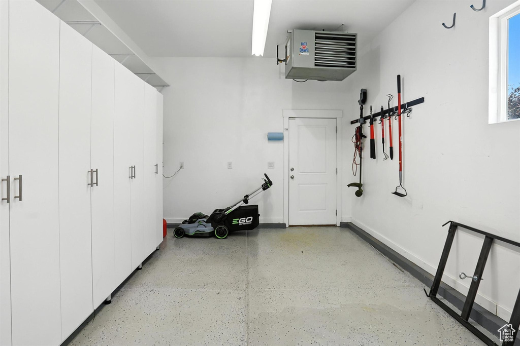 Garage with a heating unit and baseboards