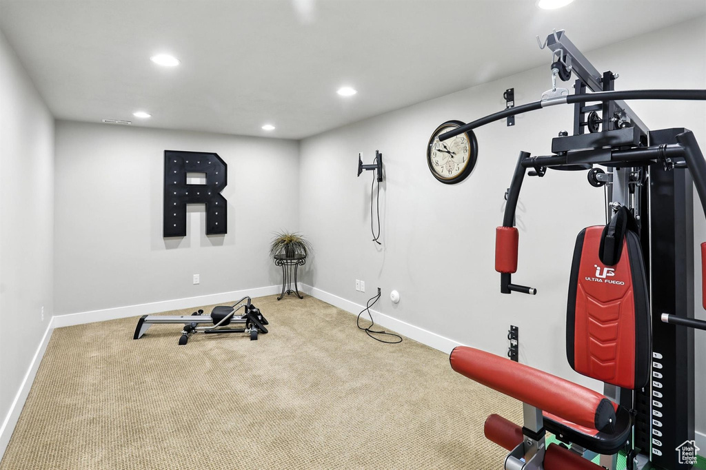 Workout room featuring carpet floors and recessed lighting
