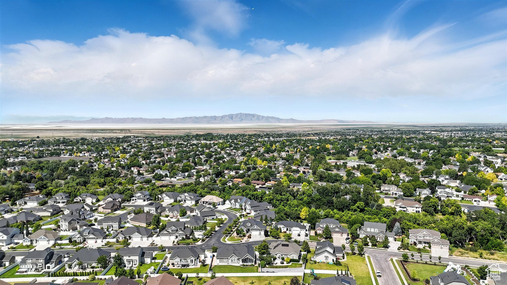 Aerial perspective of suburban area featuring a mountain backdrop