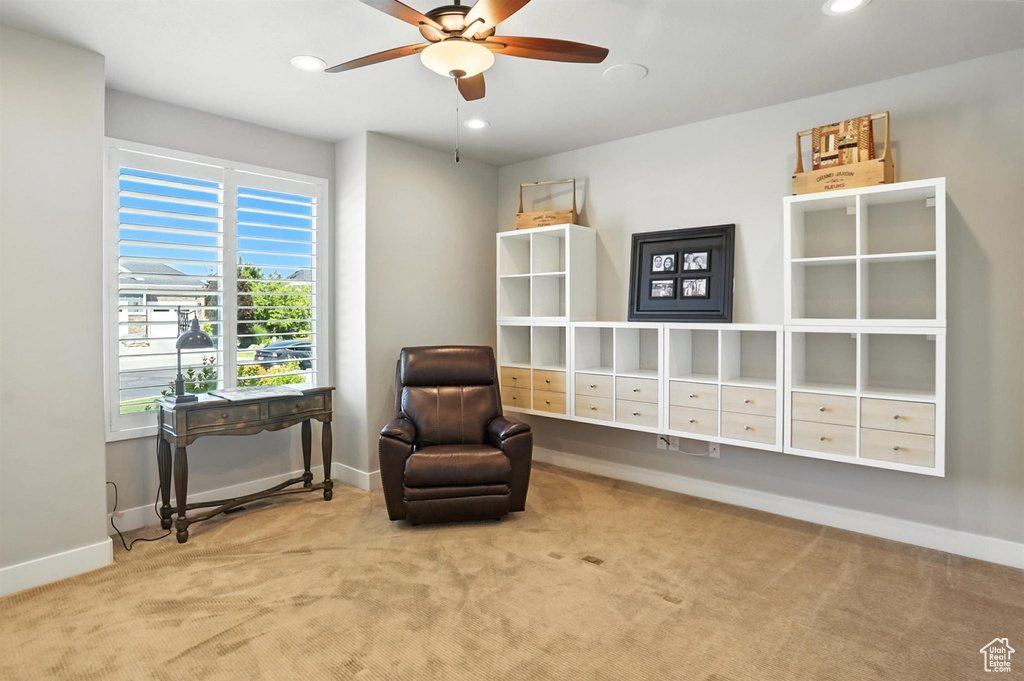 Living area featuring carpet floors, ceiling fan, and recessed lighting