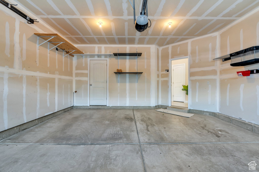 Garage featuring a garage door opener
