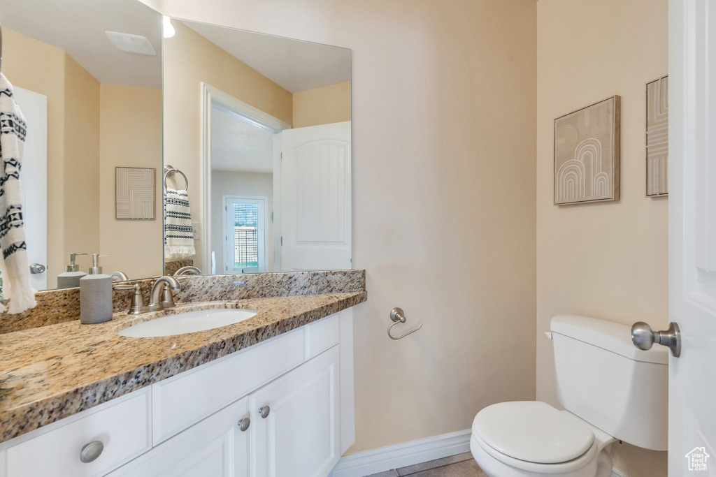 Bathroom featuring toilet and vanity