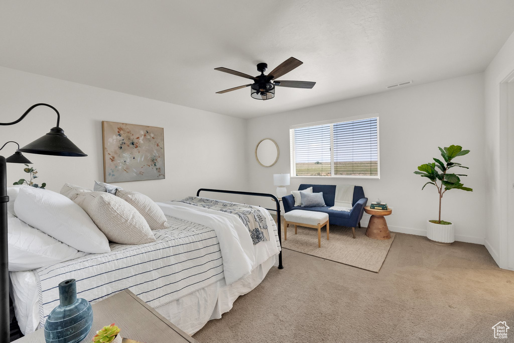 Bedroom featuring carpet floors and ceiling fan
