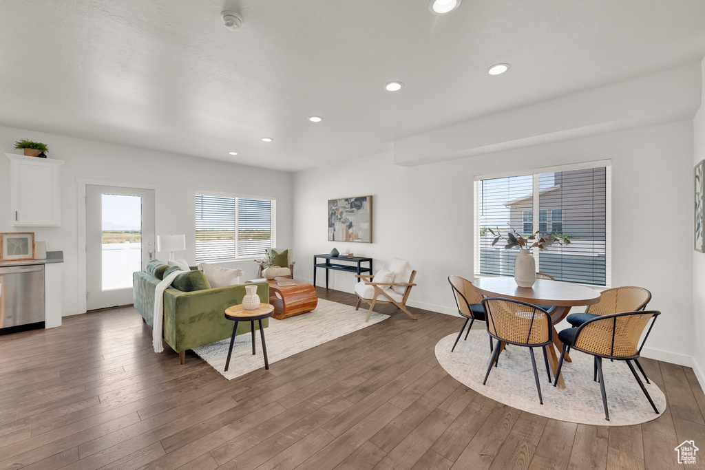 Living room with dark wood-style floors and recessed lighting
