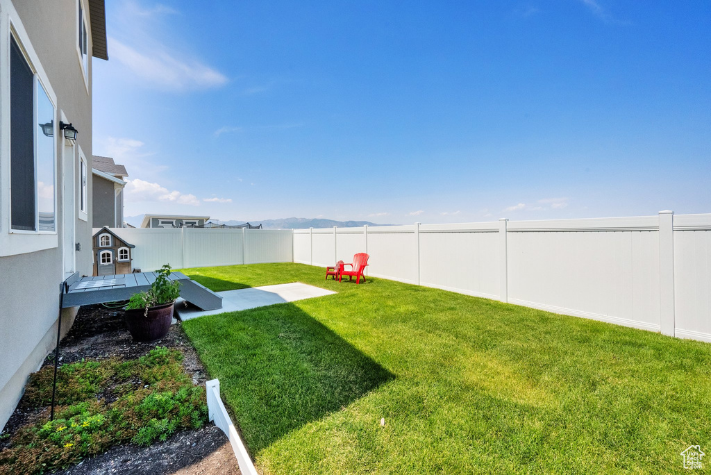 View of fenced backyard