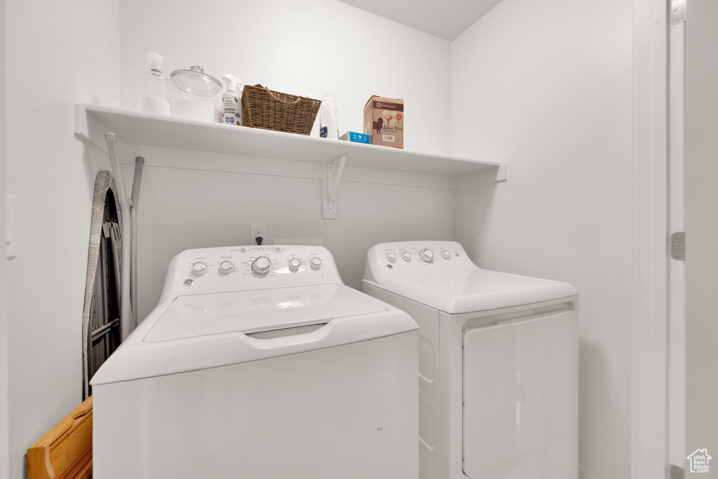 Washroom featuring independent washer and dryer