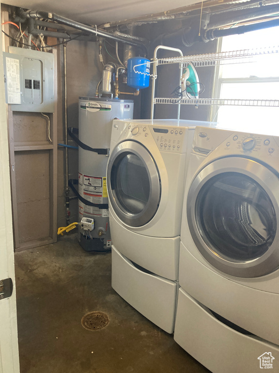 Washroom with secured water heater, independent washer and dryer, and electric panel
