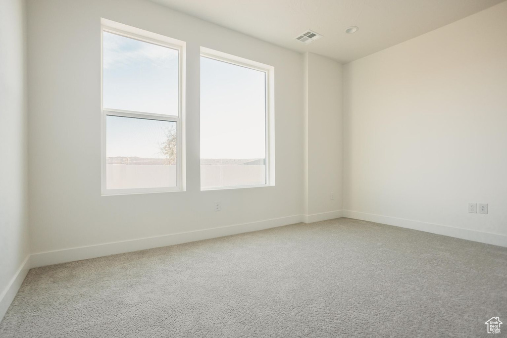 Unfurnished room with baseboards and carpet flooring