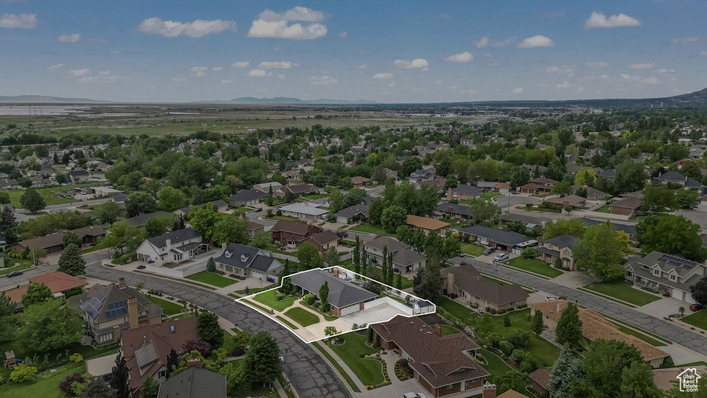 Aerial overview of property\\\'s location featuring property parcel outlined and nearby suburban area