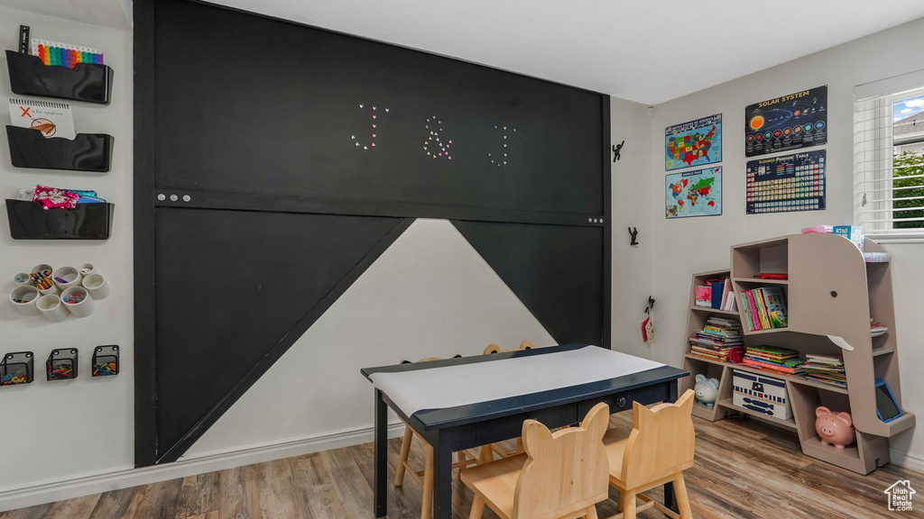 Recreation room featuring wood finished floors