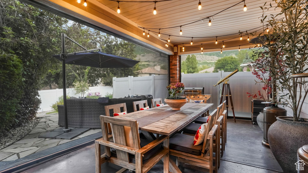 Fenced backyard featuring outdoor dining space and a patio area