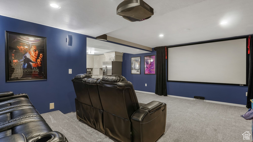 Carpeted cinema featuring recessed lighting