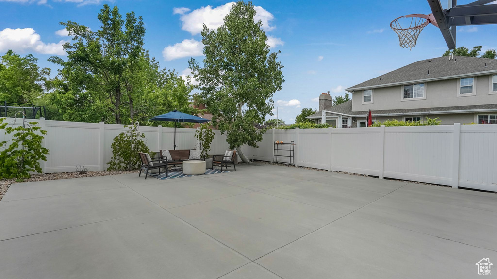 Fenced backyard with a patio area