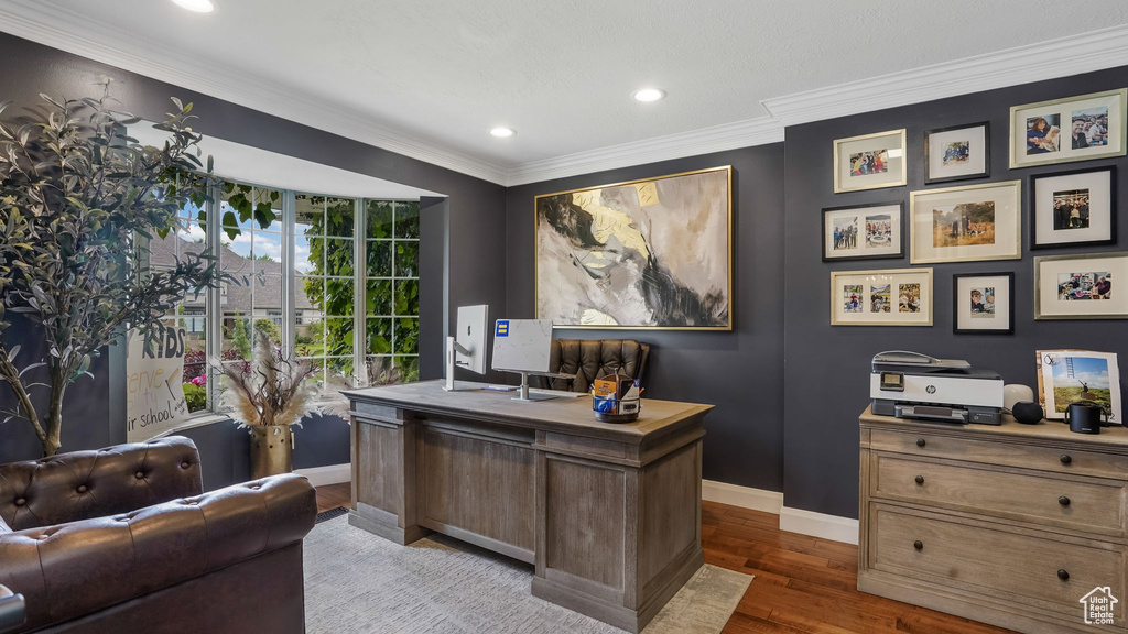 Office featuring recessed lighting, dark wood-type flooring, and crown molding