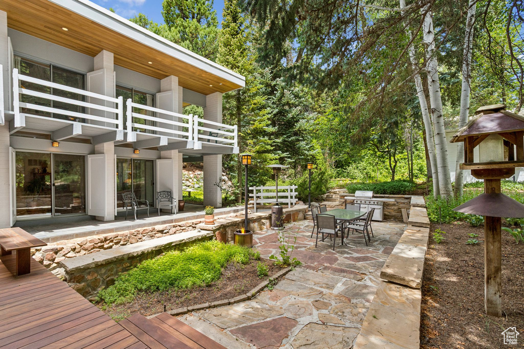 Patio / terrace featuring a patio area, outdoor dining space, and a grill