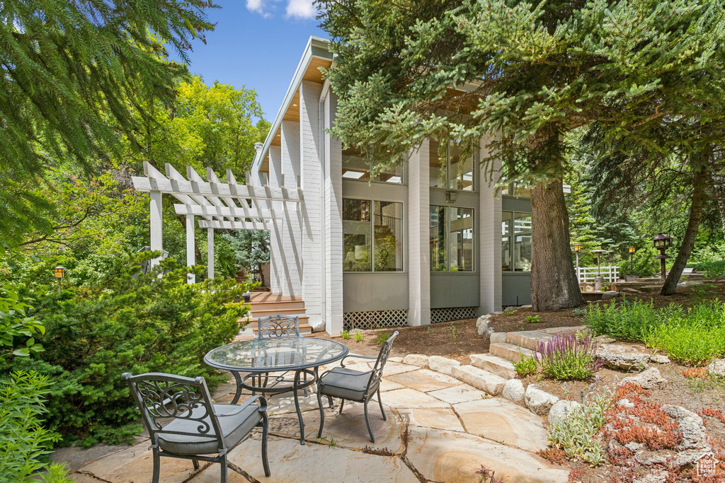 View of patio / terrace with a pergola and outdoor dining space