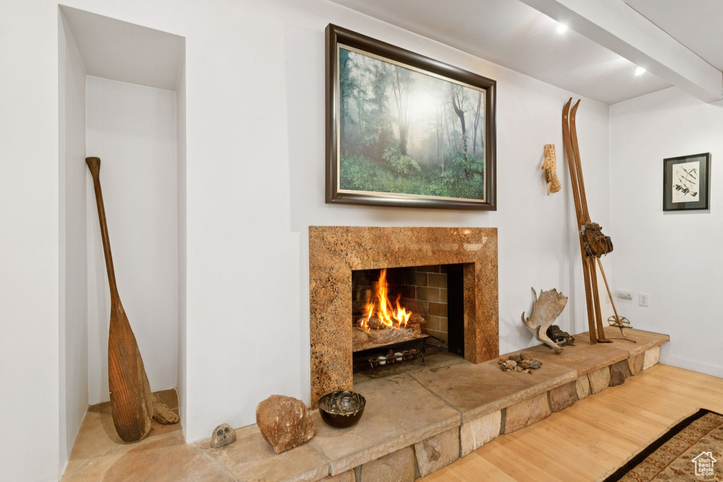 Detailed view of a high end fireplace and wood finished floors