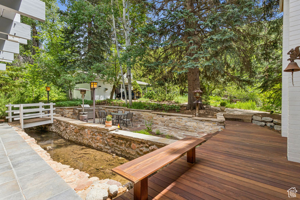 Wooden terrace with a patio area