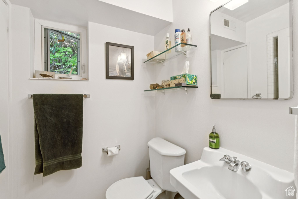 Bathroom featuring toilet and a sink
