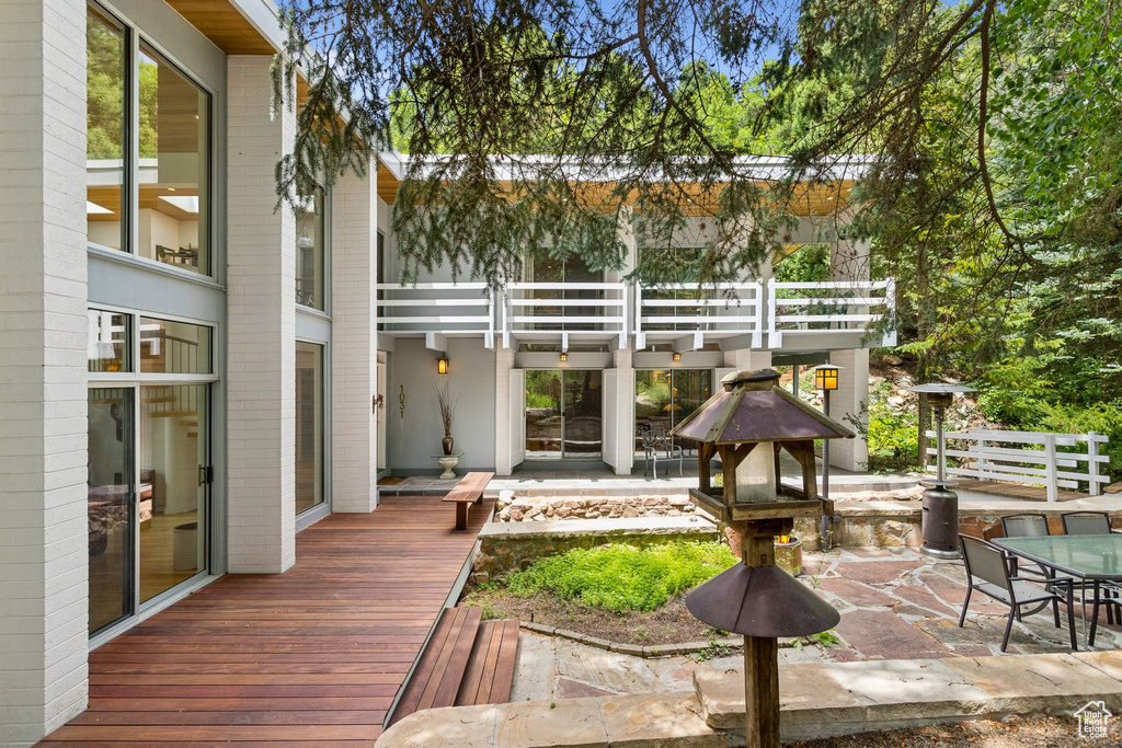Deck with a patio area and outdoor dining space