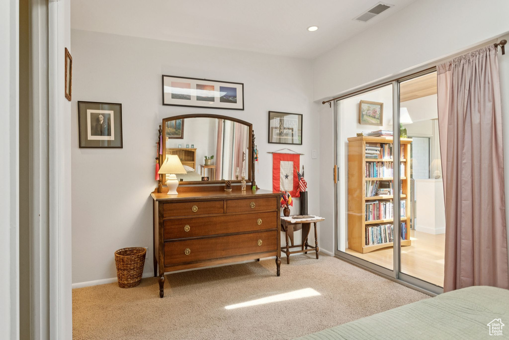Carpeted bedroom with baseboards and recessed lighting