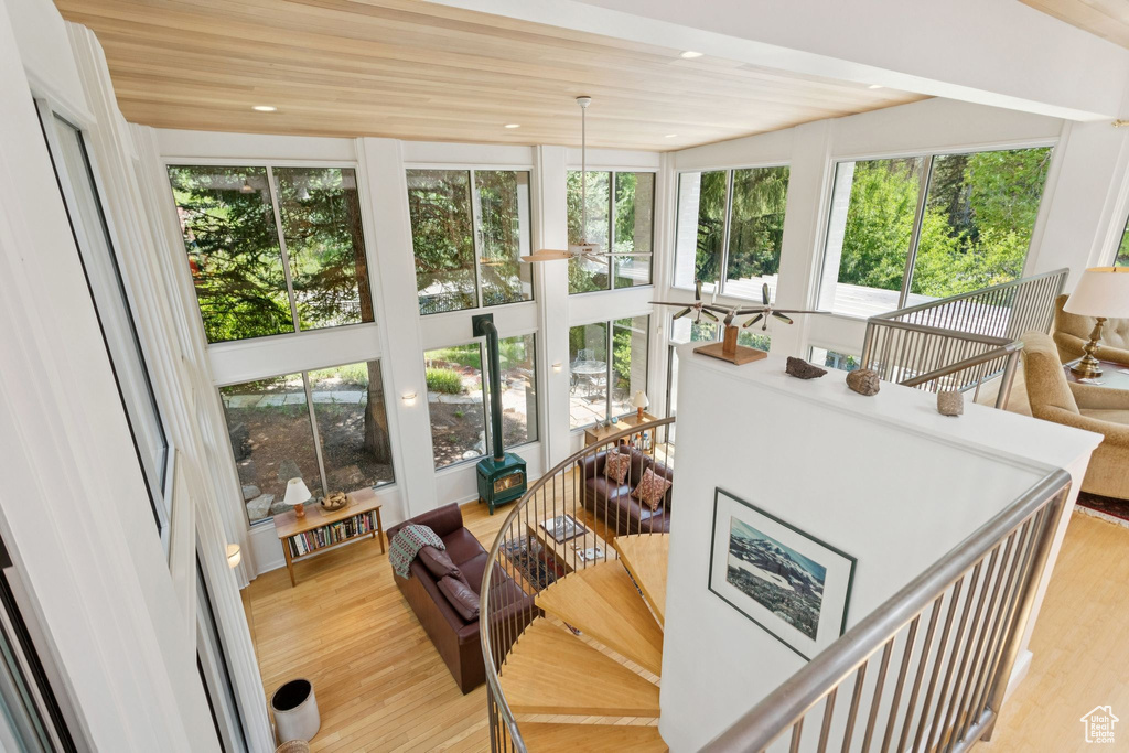 Sunroom / solarium featuring wood finished floors