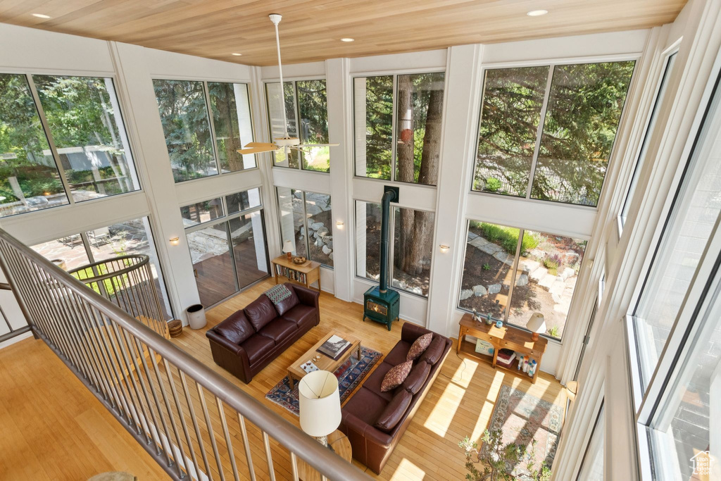 Sunroom / solarium featuring plenty of natural light, wood finished floors, and recessed lighting