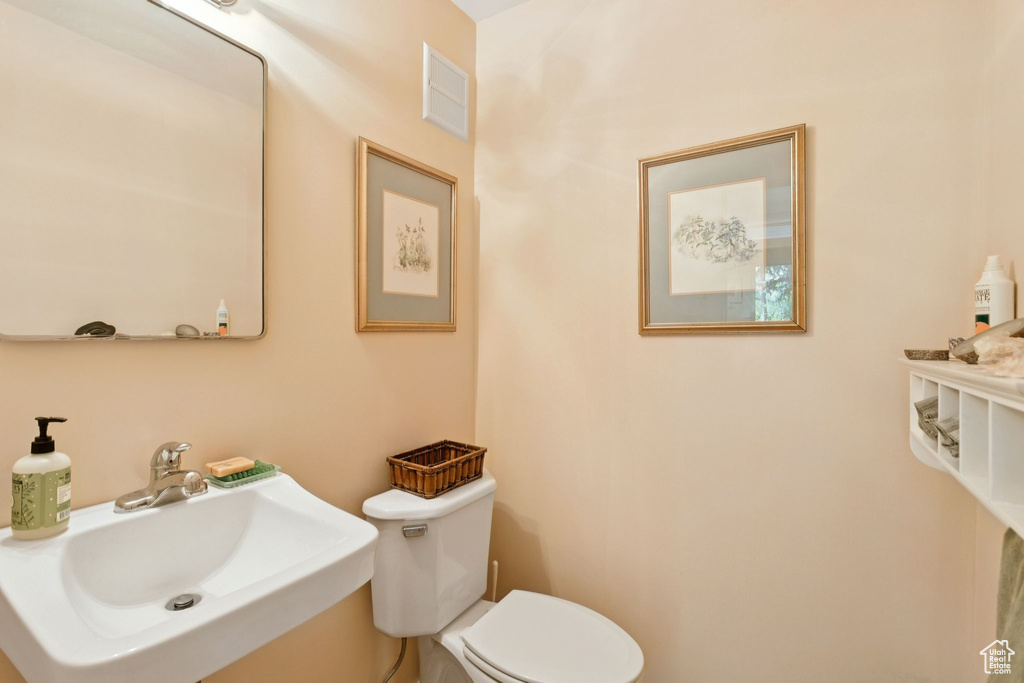 Bathroom with a sink and toilet