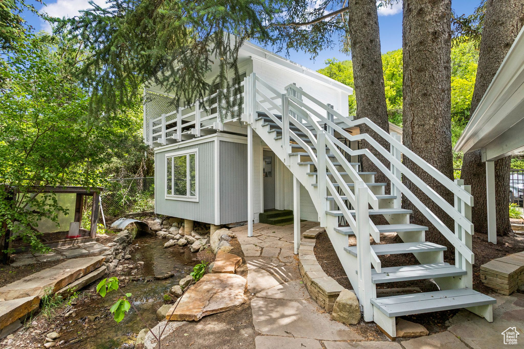 Rear view of property with stairs