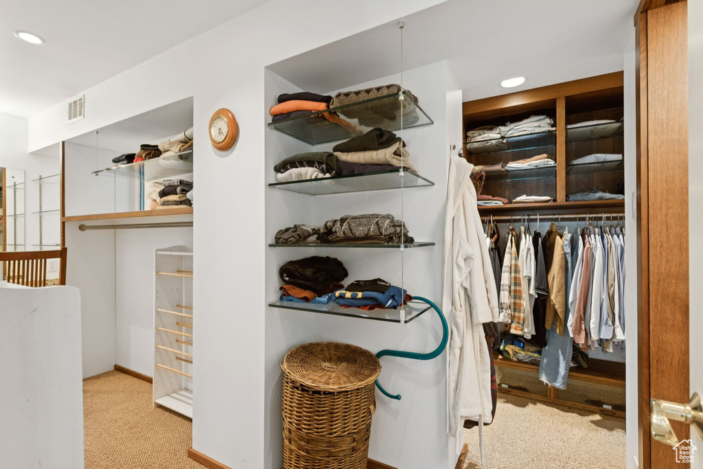 Walk in closet featuring carpet flooring