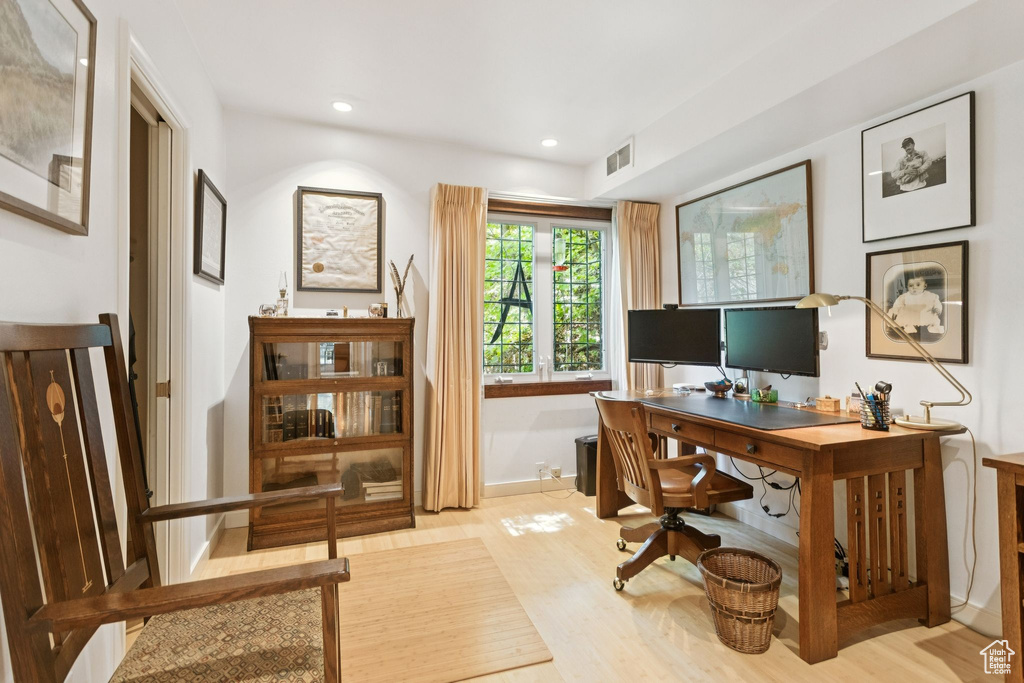 Home office featuring wood finished floors and recessed lighting