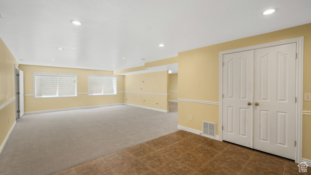 Empty room featuring carpet flooring and recessed lighting