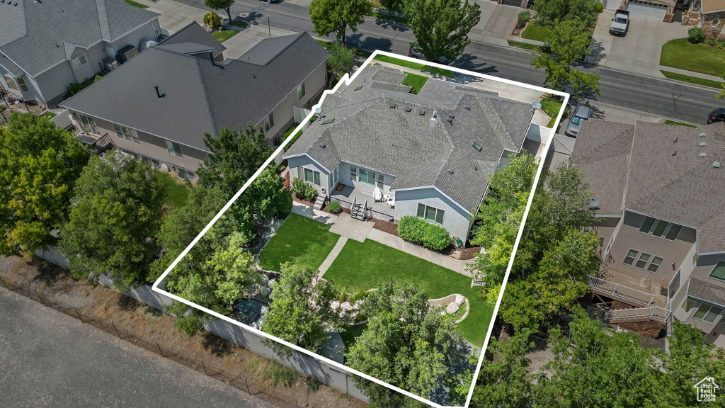 Aerial view of residential area with property boundaries highlighted