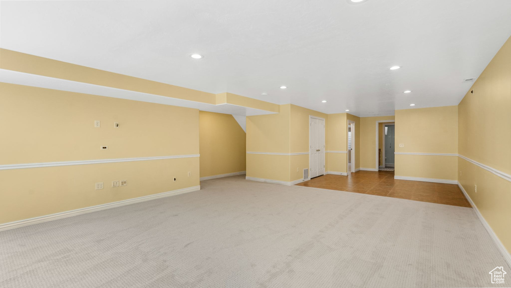 Spare room featuring carpet flooring and recessed lighting