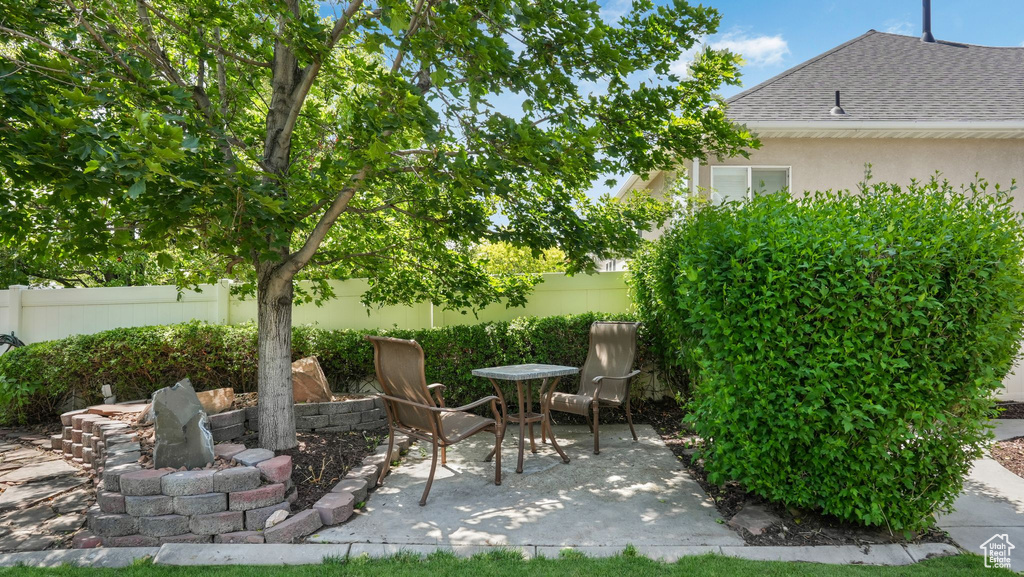 Fenced backyard with a patio