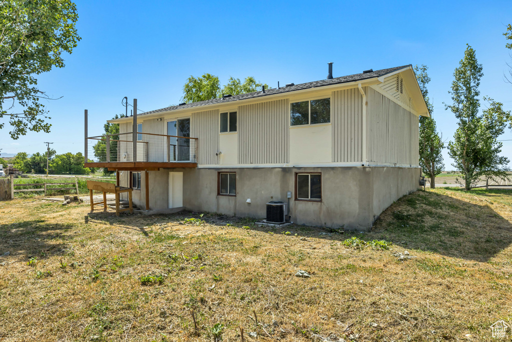 Back of property with a deck