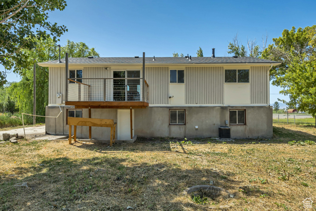 Back of property with a yard