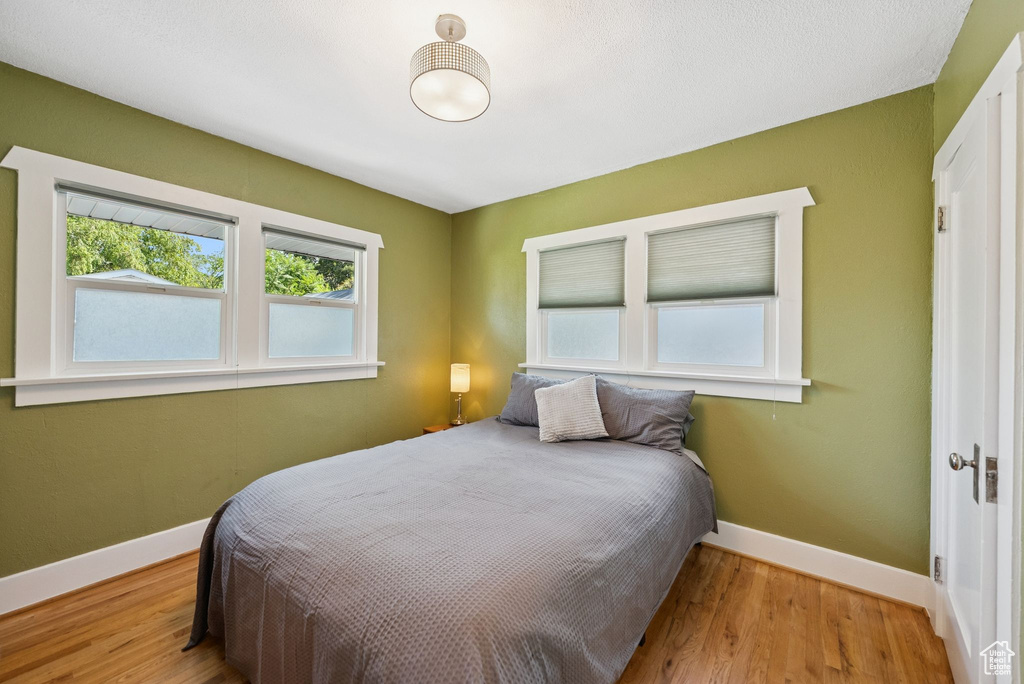 Bedroom with wood finished floors