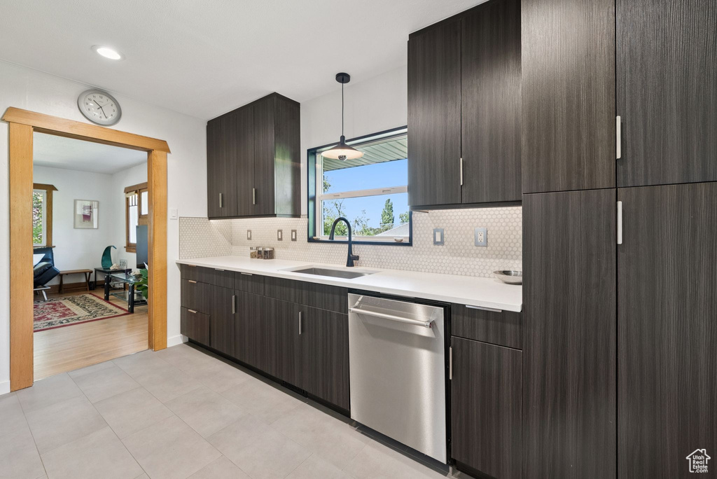Kitchen with dishwasher, light countertops, healthy amount of natural light, and recessed lighting