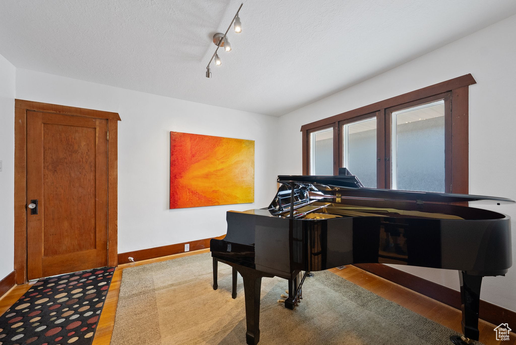 Living area featuring baseboards and light wood finished floors